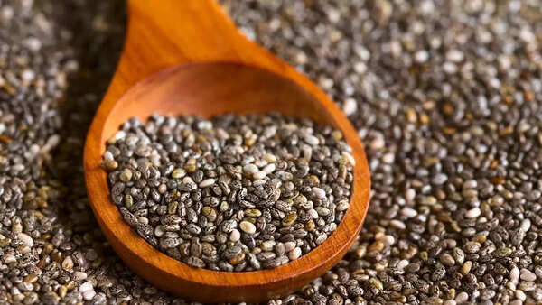 Sprinkling dry chia seeds on meals or swallowing