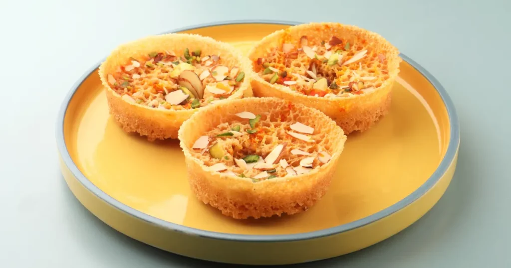 Ghevar must be familiar to you. Teej and Dusseh